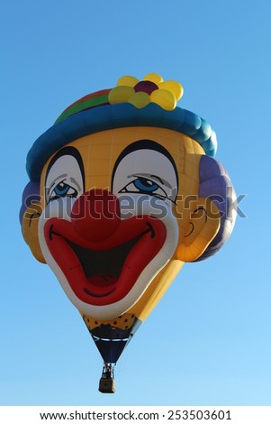 Ferrara, Italia - September 14, 2014: The photo was made at the Ballons Festival at Ferrara on september 14, 2014.A hot air balloon shaped like a clown gets up in the sky
