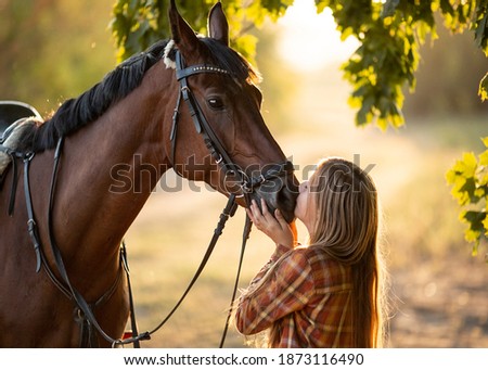 Similar – Foto Bild Mädchen, das ein Pferd küsst.