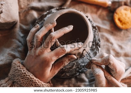Similar – Image, Stock Photo Close-up of craftswoman working on her pottery in workshop