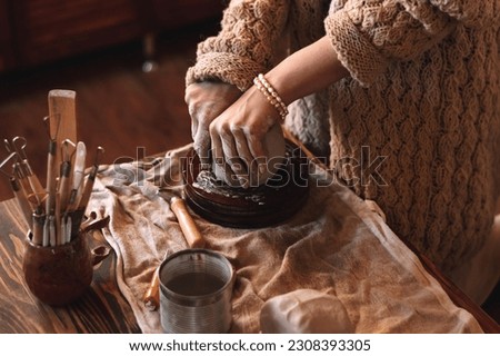 Similar – Image, Stock Photo Close-up of craftswoman working on her pottery in workshop