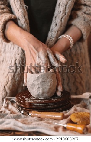 Similar – Image, Stock Photo Female ceramist making clay bowl in studio