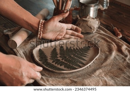 Similar – Image, Stock Photo Female ceramist making clay bowl in studio