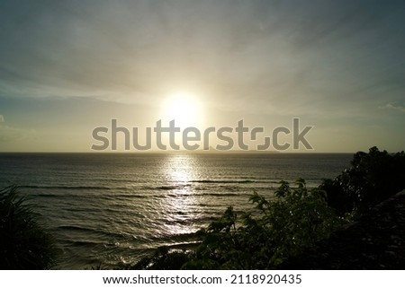 Sunset over the sea with Ie island in Okinawa. Imagine de stoc © 