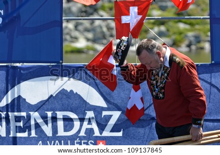 NENDAZ, SWITZERLAND - JULY 22:  first Prize to Hans Matt at the  finals of the 11th International Festival of Alpine horns :  July 22, 2012 in Nendaz Switzerland