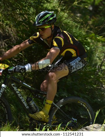 EVOLENE, SWITZERLAND - AUGUST 18: Bastien Dieffenthaler (FRA) of the Cannondale team one of the Elite starters of the Grand Raid mountain bike race:  August 18, 2012 in Evolene Switzerland