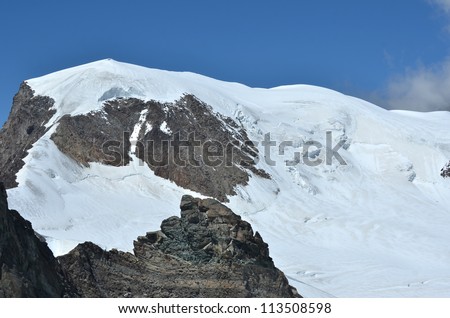 the high ice capped summit of the Alphubel in the southern swiss alps between Zermatt and Saas Fee in the Mischabel range