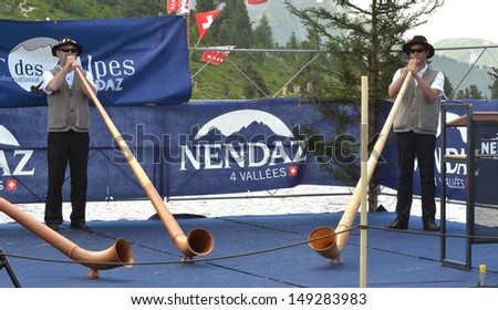NENDAZ, SWITZERLAND - JULY 28: Les Brianconneurs, competition winners at the International Alpine Horn Festival:  July  28, 2013 in Nendaz, Switzerland