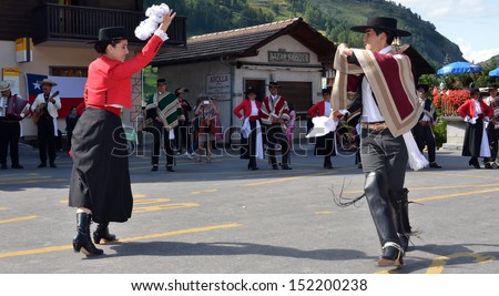 EVOLENE, SWITZERLAND - AUGUST 13: Chilean dance partners and musicians at the International Festival of Folklore and Dance from the mountains (CIME) :  August 13, 2013 in Evolene Switzerland