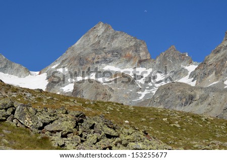 the Bertol high mountain refuge, perched on a high spike of rock surrounded by glaciers. This refuge is a necessary stop on the famous Haute Route between Chamonix and Zermatt