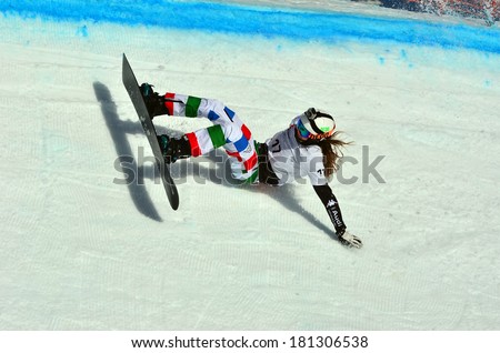 VEYSONNAZ, SWITZERLAND - MARCH 11: Sofia BELLINGHERI (ITA) crashes in the Snowboard Cross World Cup: March 11, 2014 in Veysonnaz, Switzerland