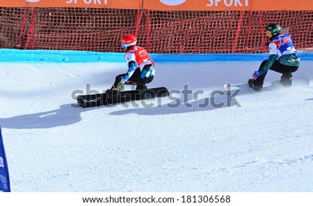 VEYSONNAZ, SWITZERLAND - MARCH 11: SCHAIRER (AUT) leads HUGHES (AUS) in the Snowboard Cross World Cup: March 11, 2014 in Veysonnaz, Switzerland