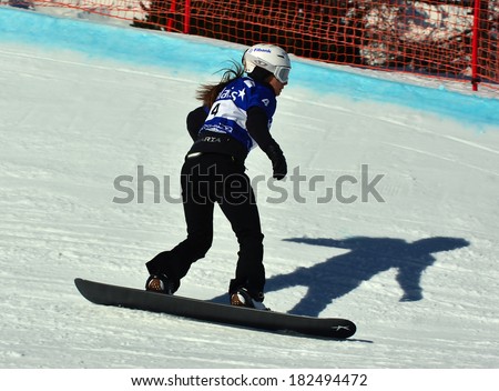 VEYSONNAZ, SWITZERLAND - MARCH 11: Finalist Alexandra JEKOVA (BUL) competing in the Snowboard Cross World Cup: March 11, 2014 in Veysonnaz, Switzerland