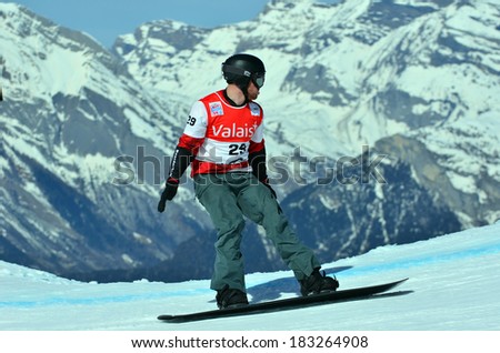 VEYSONNAZ, SWITZERLAND - MARCH 11: Mick DIERDORFF (USA) competing in the Snowboard Cross World Cup: March 11, 2014 in Veysonnaz, Switzerland