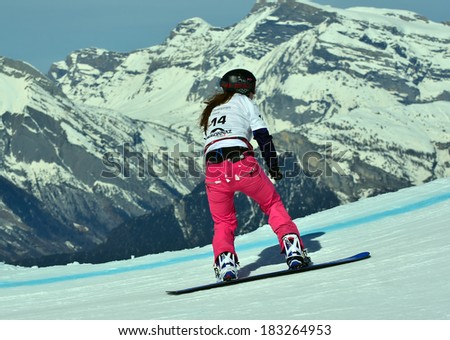 VEYSONNAZ, SWITZERLAND - MARCH 11: Chloe TRESPEUCH (FRA) competing in the Snowboard Cross World Cup: March 11, 2014 in Veysonnaz, Switzerland