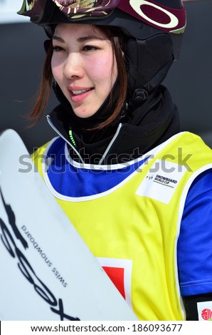 VEYSONNAZ, SWITZERLAND - MARCH 11: Finalist Yuka FUJIMORI (JPN) in the Snowboard Cross World Cup finals: March 11, 2014 in Veysonnaz, Switzerland