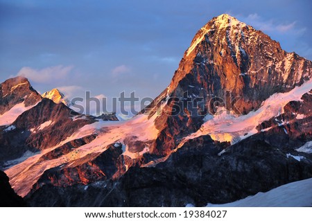 Dent Blanche, Grand Cornier; Weisshorn, and Zinal Rothorn all above 4000m in the swiss alps. seen at sunset from the Bertol Mountain refuge.