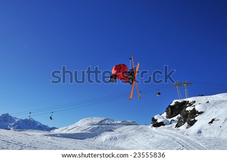 aerial skier doing a combination of a tele-heli and sumersault