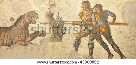 magnigficent byzantine mosaic of two soldiers with spears fighting a tiger
