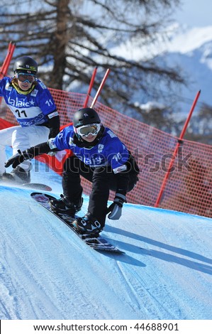 VEYSONNAZ, SWITZERLAND - JANUARY 15:  FIS World Championship Snowboard Cross finals. Japanese Yuka fujimori leads against Natsuko Doi on January 15, 2010 in Veysonnaz, Switzerland