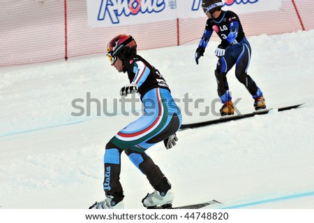 NENDAZ, SWITZERLAND - JANUARY 17: FIS World Championship Snowboard Giant Parallel Finals. Italian finalists March(r) and Fischnaller (l) head to head.  January 17, in Nendaz, Switzerland