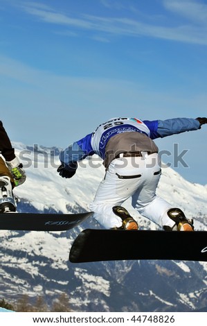 VEYSONNAZ, SWITZERLAND - JANUARY 15: World championship Snowboard cross  finals. Swiss finalist Fabio Caduff leaping. January 15 in Veysonnaz, Switzerland.