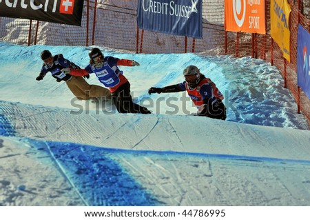 VEYSONNAZ, SWITZERLAND - JANUARY 15: World championship Snowboard cross  finals. Dominique Maltais from Canada leads the pack in the ladies finals. Janary 15, 2010 in Veysonnaz, Switzerland.