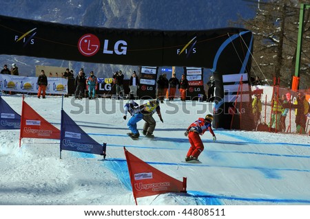 VEYSONNAZ, SWITZERLAND - JANUARY 15: World championship Snowboard cross  finals. Tanja Frieden and Simona Meiler (l) on finishing line of the small final. January 15 in Veysonnaz, Switzerland.