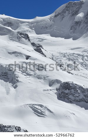 ski tracks in extreme terrain on the schwarzegletcher between the breithorn and Castor and Pollux