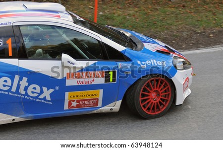 SION, SWITZERLAND - OCTOBER 28: the leader on Day 1, Stage 1 of the International Rally of the Valais Rossetti Luca in a grande punto: October 28, 2010 in Sion Switzerland
