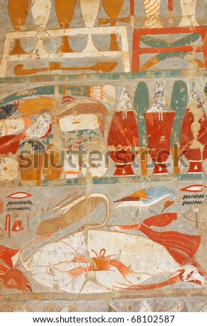 Ancient Egyptian painting of large quantities of food including a trussed bull