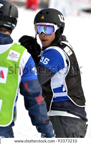 VEYSONNAZ, SWITZERLAND - JANUARY 22: Jonathan Cheever (USA) in the final of the FIS World Championship Snowboard Cross finals : January 22, 2012 in Veysonnaz Switzerland