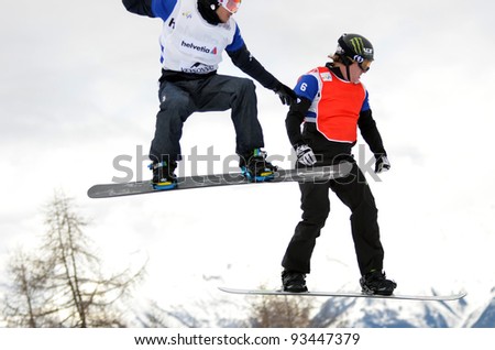VEYSONNAZ, SWITZERLAND - JANUARY 22: World champion Nate Holland (r) with Luca Matteoli (l) in the  FIS World Championship Snowboard Cross finals : January 22, 2012 in Veysonnaz Switzerland