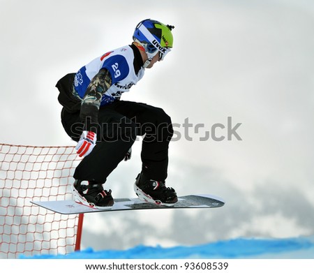 VEYSONNAZ, SWITZERLAND - JANUARY 21: Nikolay Olyunin (RUS) FIS World Championship Snowboard Cross finals : January 21, 2012 in Veysonnaz Switzerland