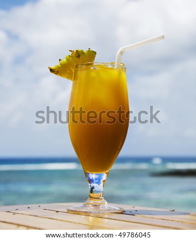Lovely fresh fruit cocktail on a tropical island beach
