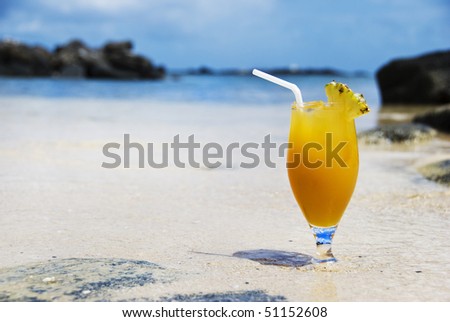 a Fresh fruit cocktail on a tropical island beach
