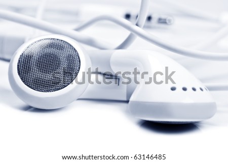 Macro close up of white earphones - very shallow depth field