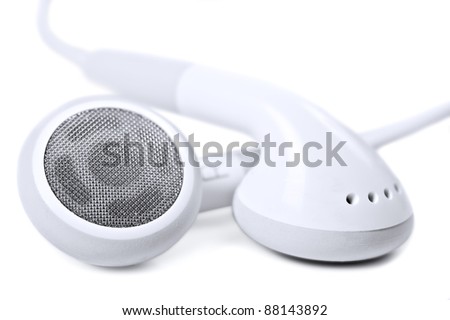 Macro close up of white earphones - very shallow depth field