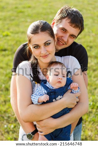 Happy young family in park