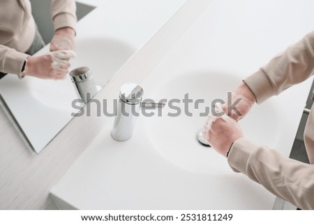 Similar – Image, Stock Photo unrecognizable woman using disinfectant alcohol gel in a car before driving. Clean hands concept