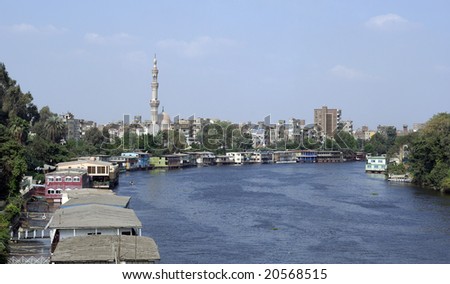 View of Cairo. River, houses, minaret tower.