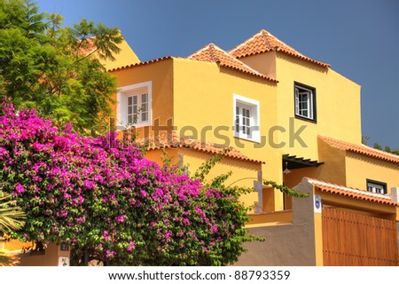 Classical spanish villa among flowers, not far from ocean. Tenerife, Spain.