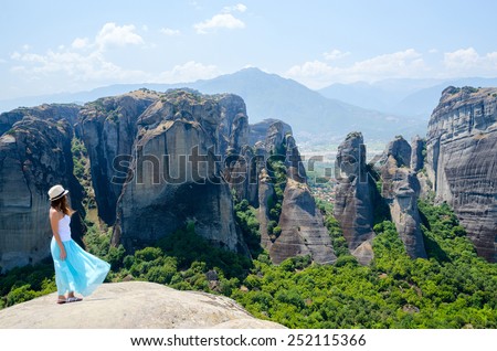 METEORS, GREECE - AUGUST 11, 2014: Unknown girl on a viewing platform in Meteors (Greece) admires the views