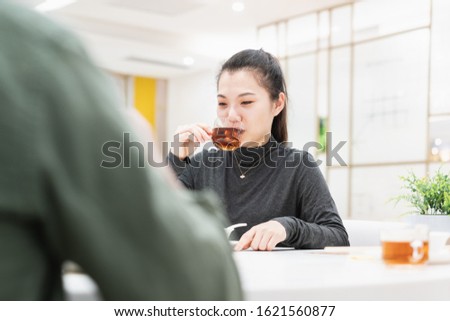 Young asian woman talking face to face in restaurant 商業照片 © 