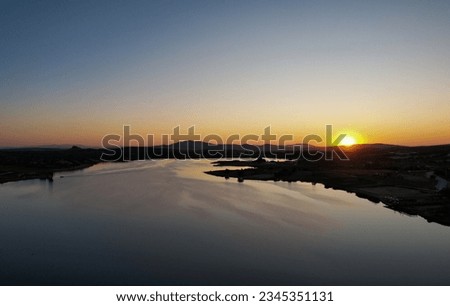 Similar – Image, Stock Photo ***3000*** Reflection of sun in puddle with ice and foliage closeup bokeh