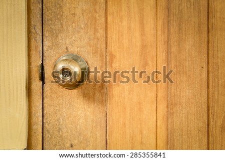 steel door knob on the wooden door