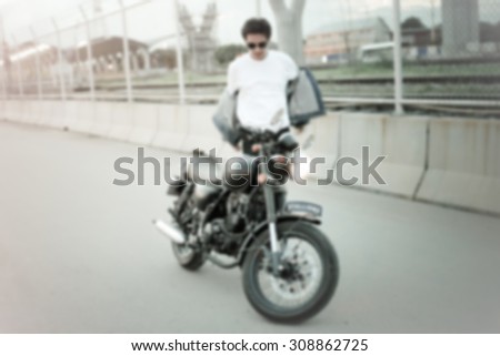 vintage motorbike rider ,blur background