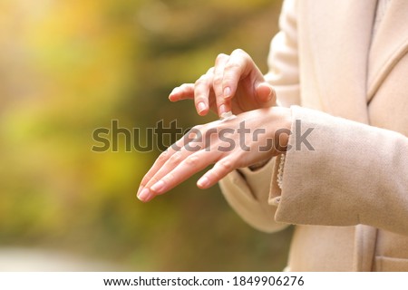 Similar – Image, Stock Photo female hands in winter gloves in a red and white striped hugging behind green Christmas tree outdoors. Christmas and New Year holiday concept