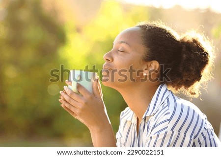 Similar – Image, Stock Photo Relaxed woman with cup of coffee in hammock