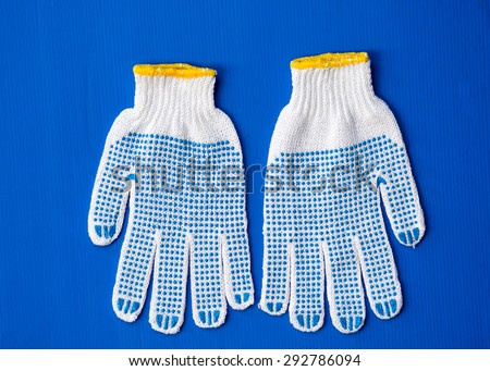 protection gloves on blue plate