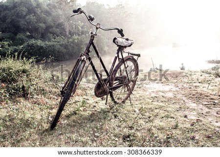 old bicycle in morning on river side